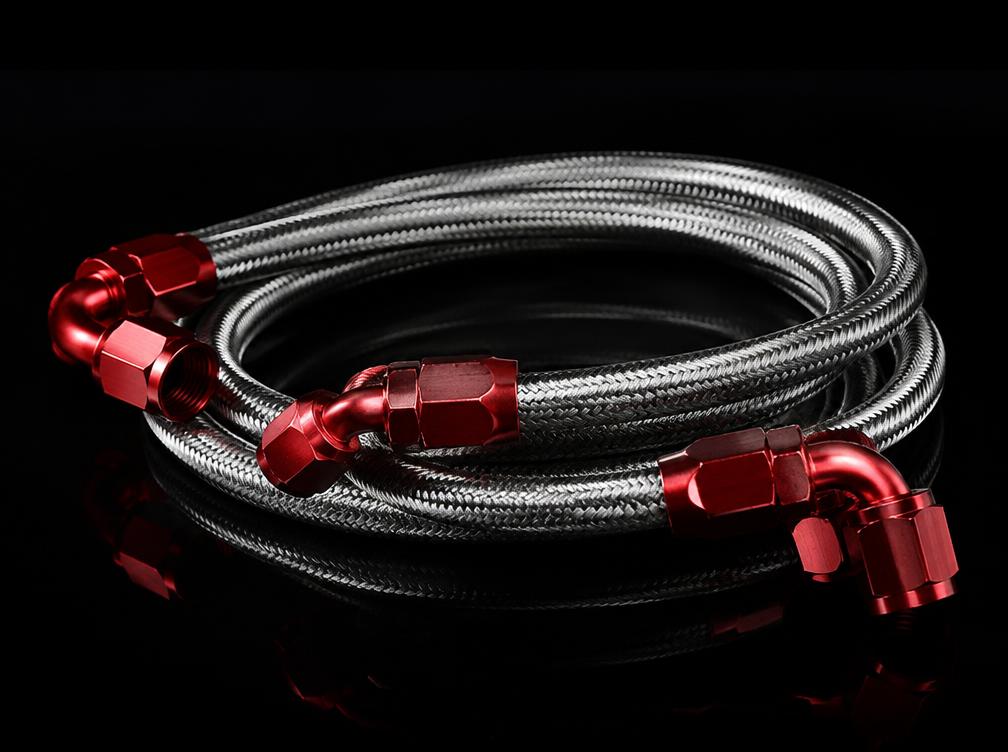 Braided stainless steel motorsport hoses with red anodised ends